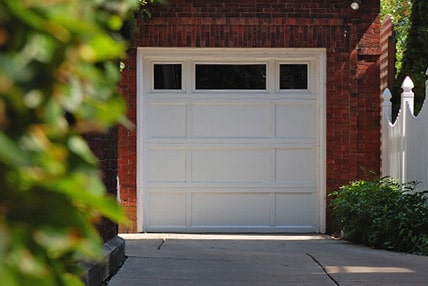 Short panel long panel steel garage door with plain windows