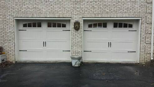 Steel carriage house stamped garage door with stockton windows