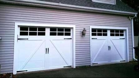 clopay Carriage house garage door in A-brace design with straight windows and decorative hardware