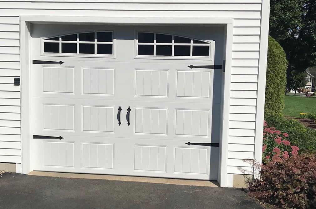 Clopay Bead board short panel garage door white with arched grilles and plain glass