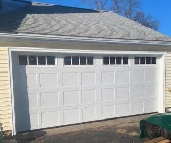 Haas Recessed short panel garage door, carriage house spacing, with long windows in white
