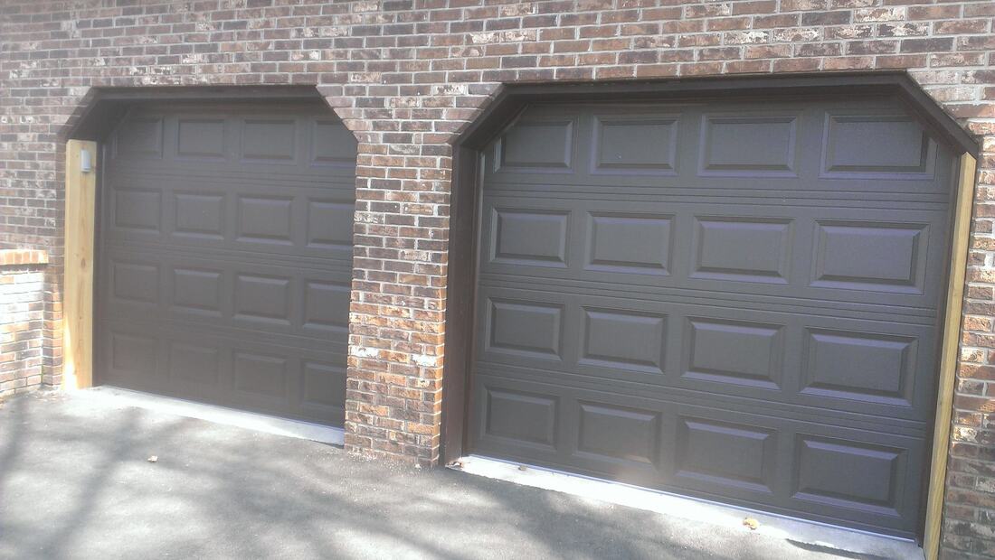 Clopay Brown raised panel garage door without windows